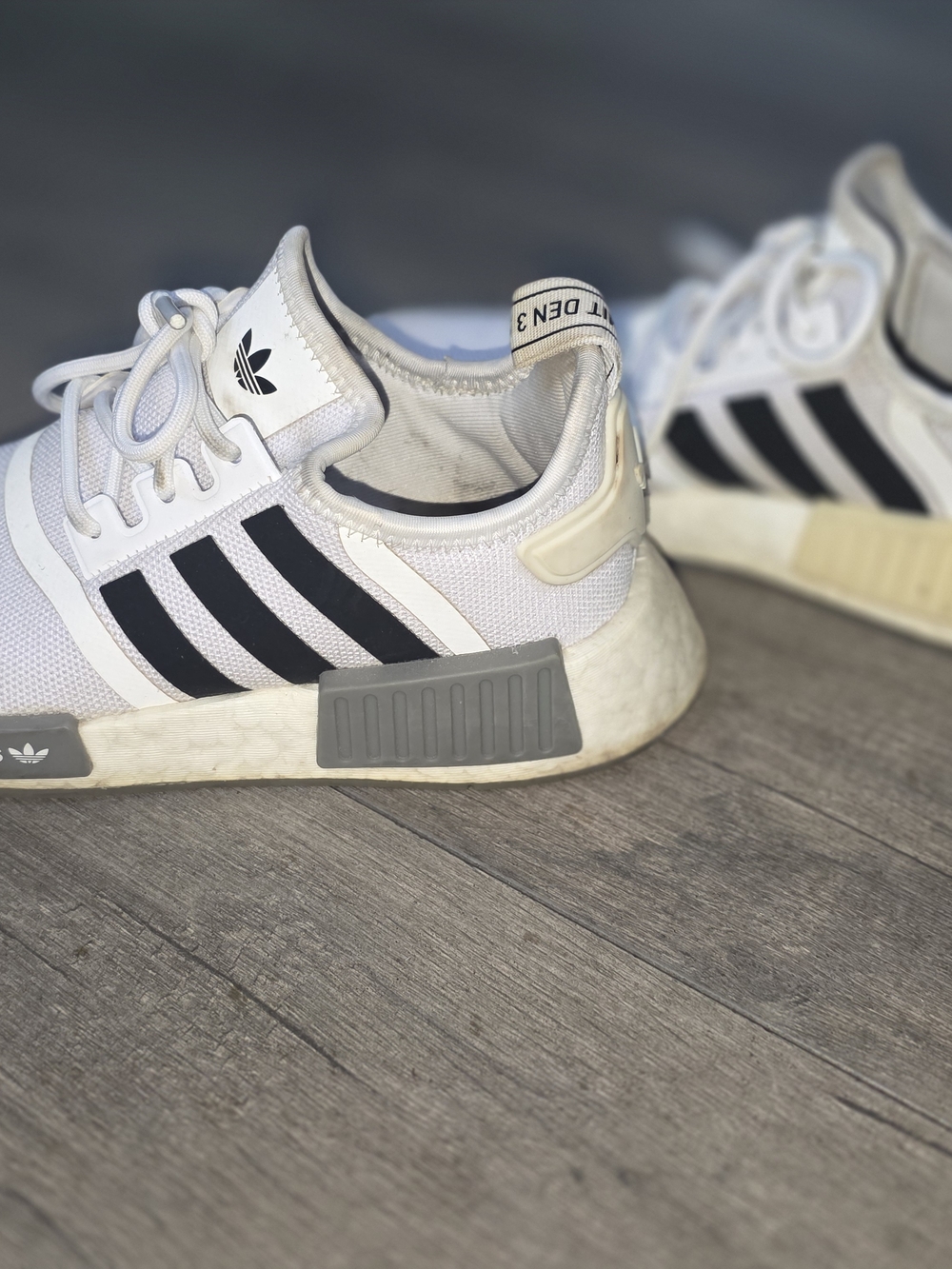 Adidas White NMD R1 Sneakers with Black Stripes